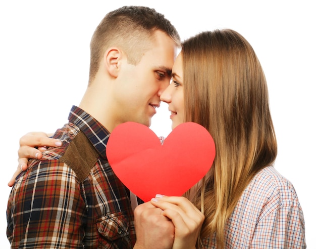 Happy couple in love holding red heart