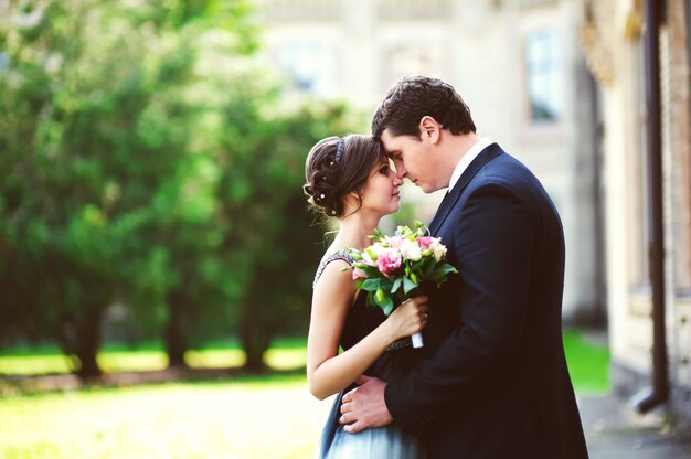 Happy couple in love hugging outdoors