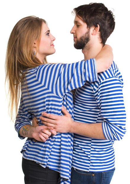 Happy couple in love hugging on a white  background