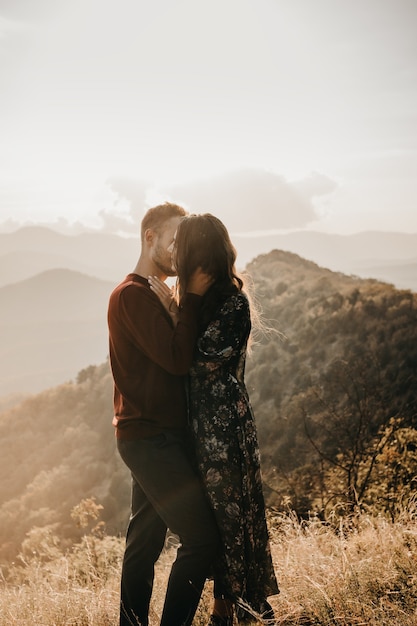 Happy couple in love in the mountains