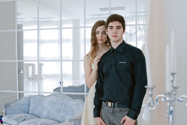 Happy couple in love. Valentine's Day. girl stands behind her boyfriend