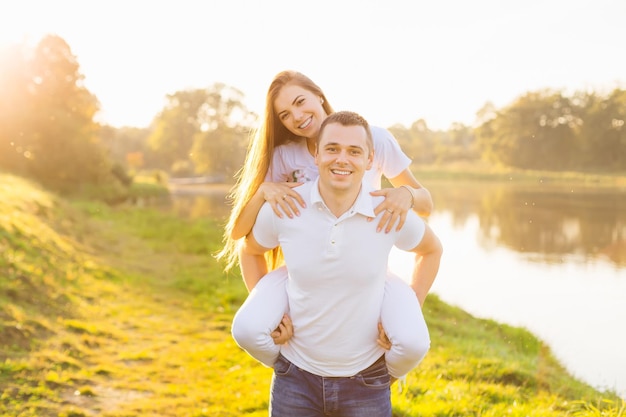 Happy couple in love on a walk on a beautiful summer day beautiful girl with a guy having fun