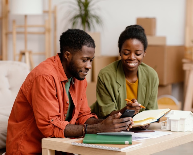 Happy couple making plans to redecorate house