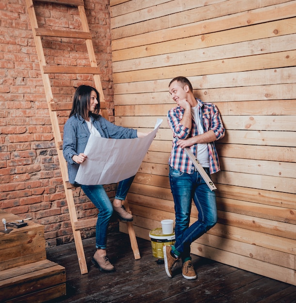 Photo happy couple making repairs to their home.