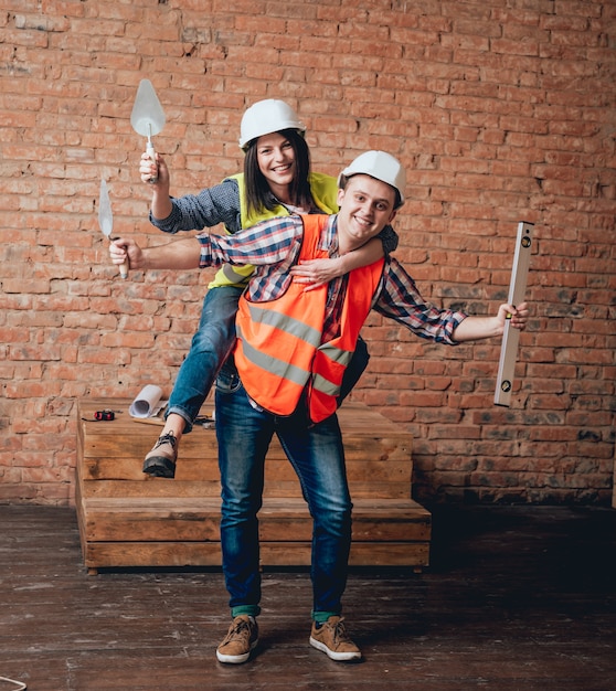 Happy couple making repairs to their home.