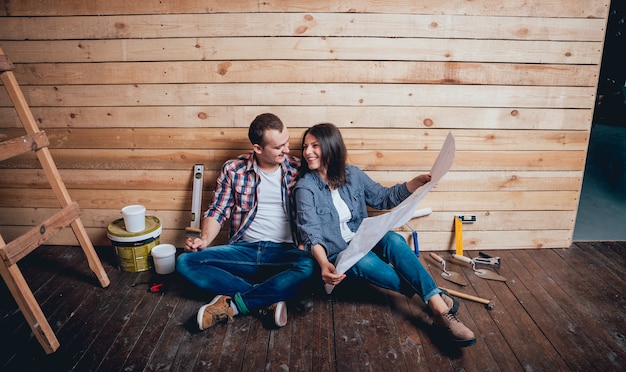 Happy couple making repairs to their home.