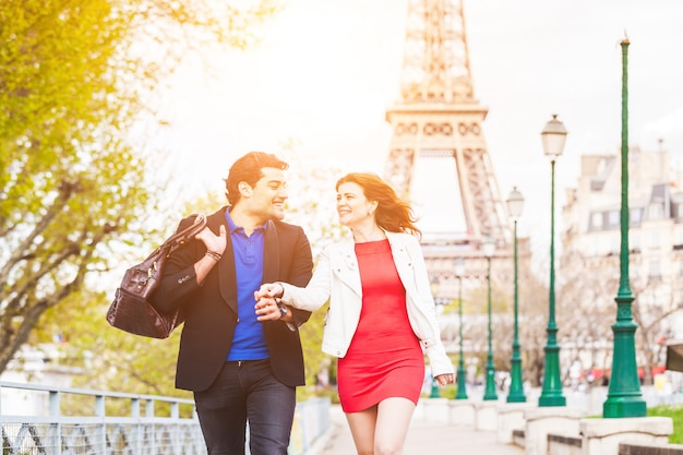 Happy couple in Paris with Eiffel Tower