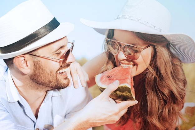 Happy couple on picnic in the park