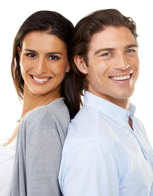 Happy couple portrait smile and back together in relationship isolated against a white studio background Woman and man face smiling in happiness and touching backs in romance bonding or commitment