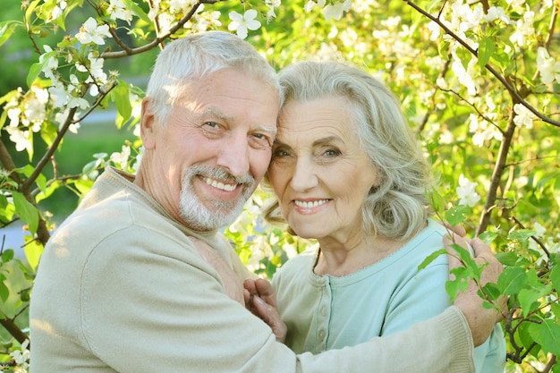 Happy couple posing in park