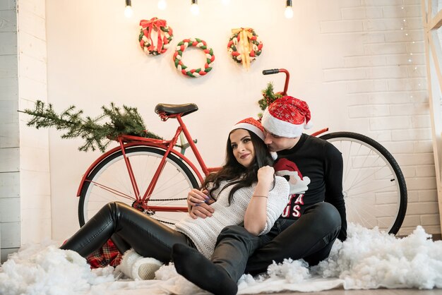 Happy couple posing with new year decorations