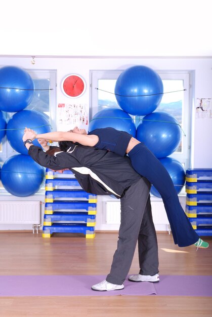 .happy couple recreating in fitness studio