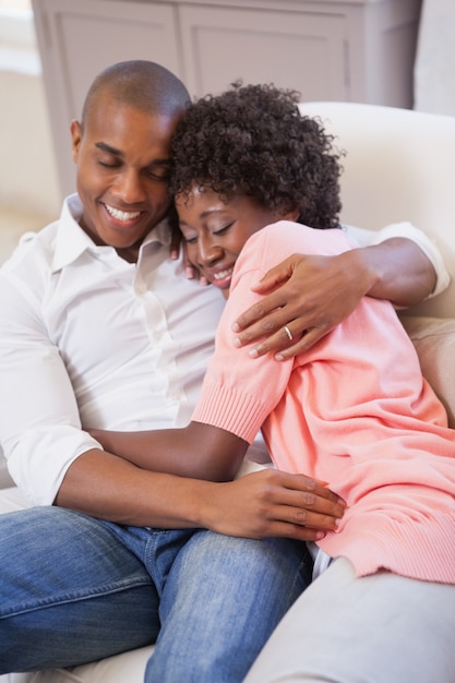 Happy couple relaxing on the couch