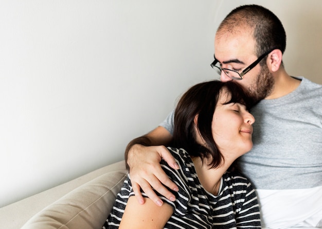 Happy couple relaxing at home