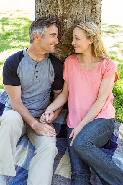 Happy couple relaxing in the park