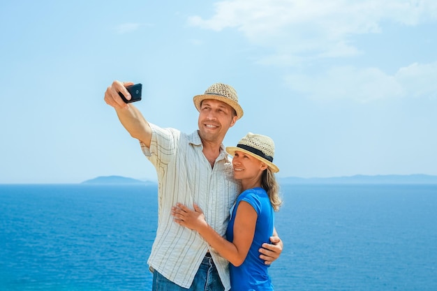 A happy couple selfie at sea on travel