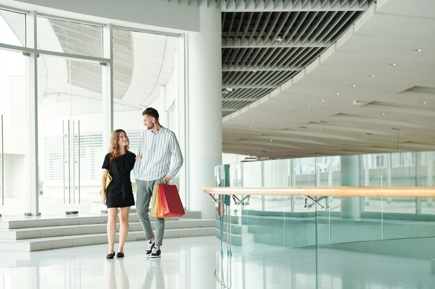 Happy couple in shopping mall