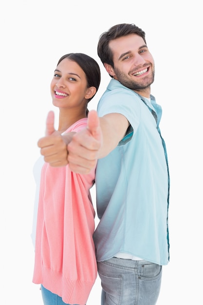 Happy couple showing thumbs up