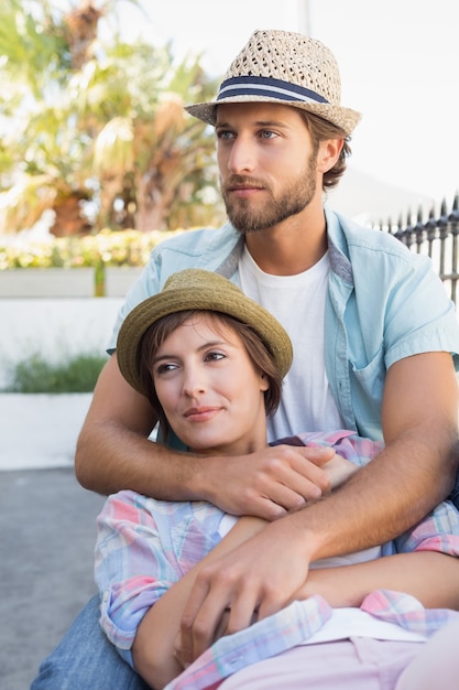 Happy couple sitting and cuddling