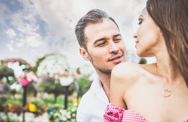 Happy couple spending time in a flower park