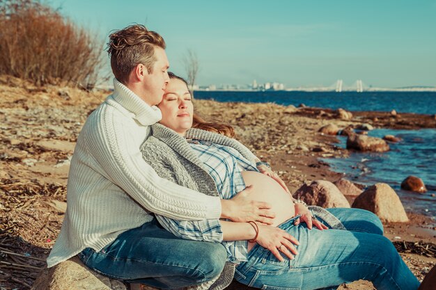 Happy couple spends time by the sea