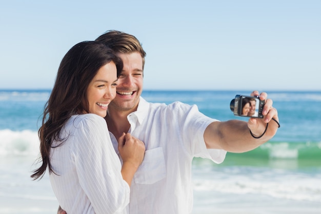 Happy couple taking a photo