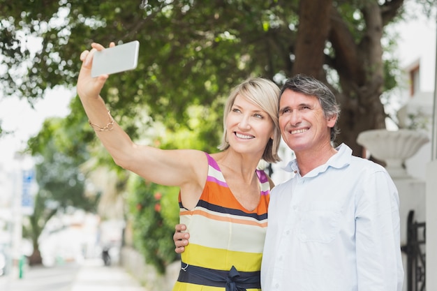 Happy couple taking selfie