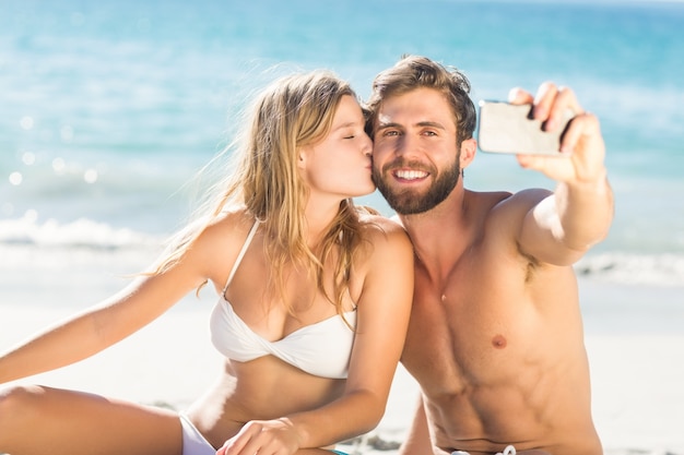 Happy couple taking selfie