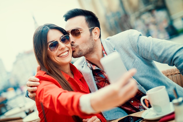 Happy couple taking a selfie