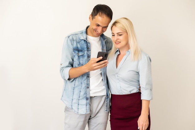 Happy couple using smartphone together