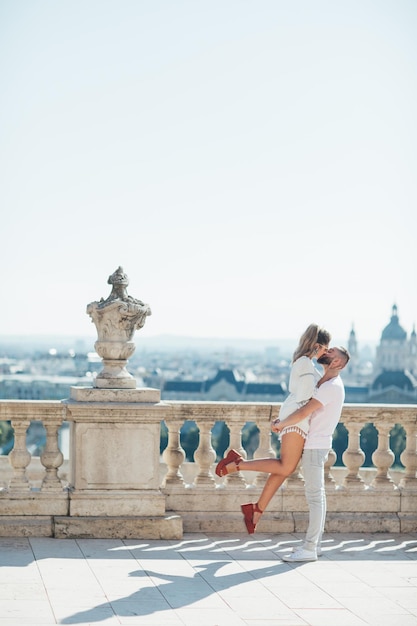 Happy couple walking in city