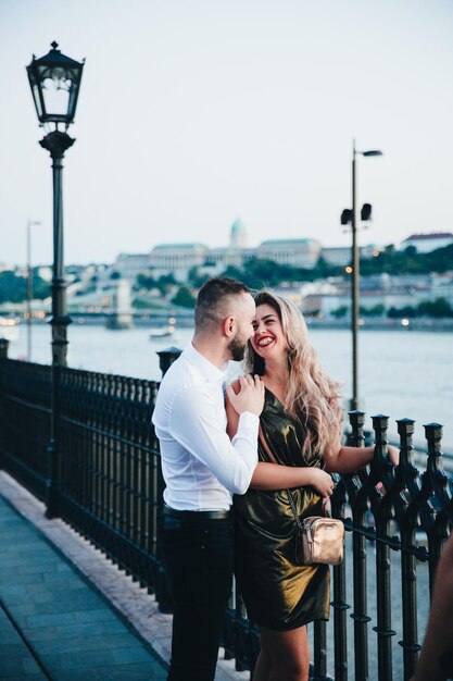 Happy couple walking in night city