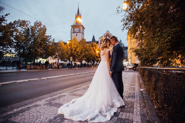 Happy couple walking in night city