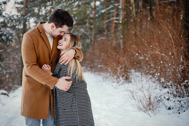 Happy couple walking through the park