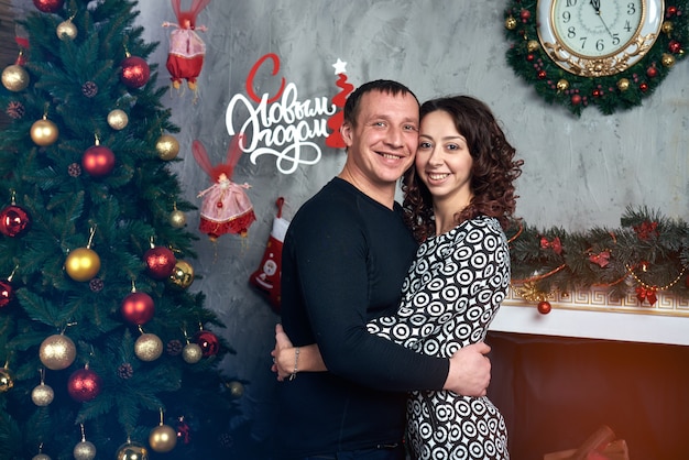 Happy couple with Christmas decorations