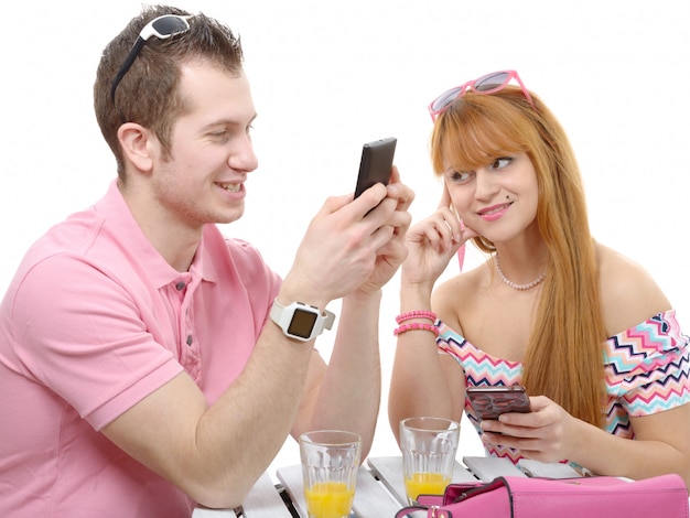 Happy couple with mobile phones