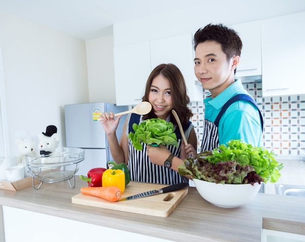 Happy couples in kitchen