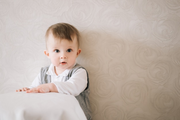 Happy cute boy in a gentleman suit