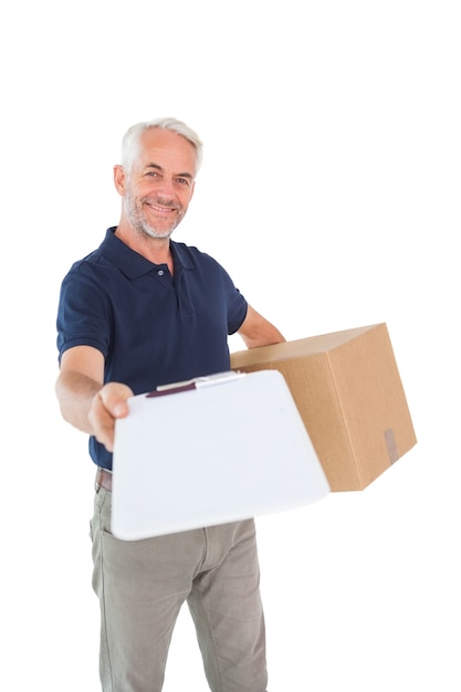 Happy delivery man holding cardboard box and clipboard