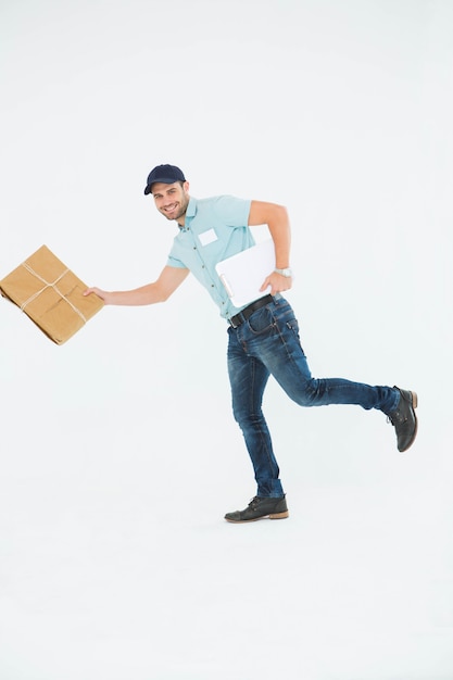 Happy delivery man running with package