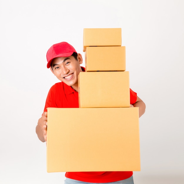 Happy delivery man with box. Isolated on a White Background.