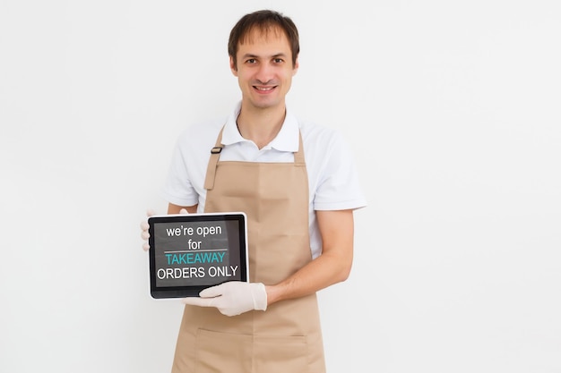 Happy delivery man with tablet. isolated white background