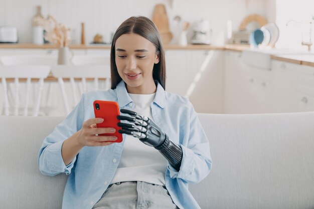 Happy disabled european woman is chatting on smartphone Equality and life quality concept