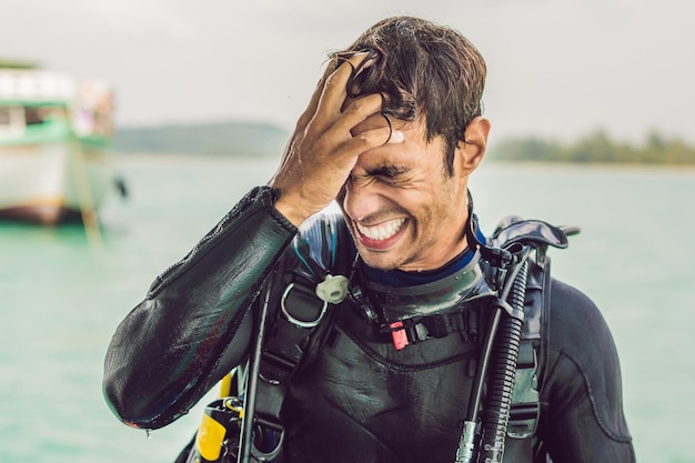 Happy diver returns to the ship after diving