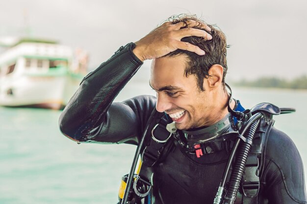 Happy diver returns to the ship after diving