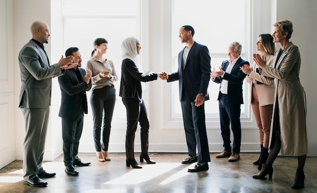 Happy diverse business people making a deal