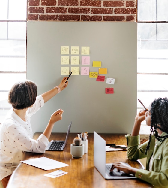 Happy diverse businesswoman brainstorming ideas