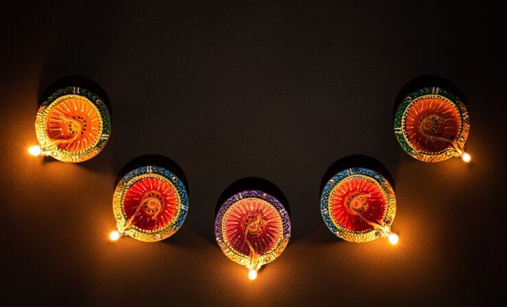 Happy Diwali  Clay Diya lamps lit during Dipavali Hindu festival of lights celebration