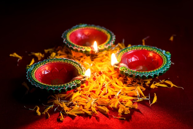 Happy Diwali - Clay Diya lamps lit during Diwali celebration. Greetings Card Design of Indian Hindu Light Festival called Diwali