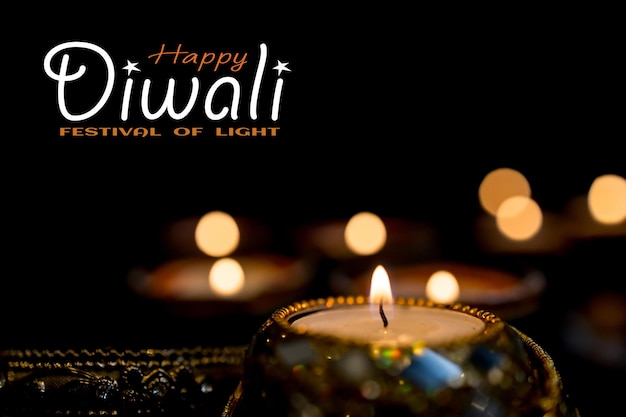 Photo happy diwali clay diya lamps lit during dipavali hindu festival of lights celebration colorful traditional oil lamp diya on dark background copy space for text